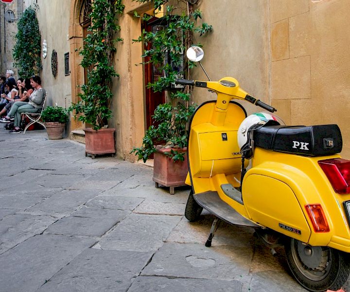 yellow_scooter_in_the_streets_original_935345.jpg